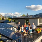 Residential solar panels Kelowna installed on a modern home with a family enjoying their eco-friendly lifestyle.